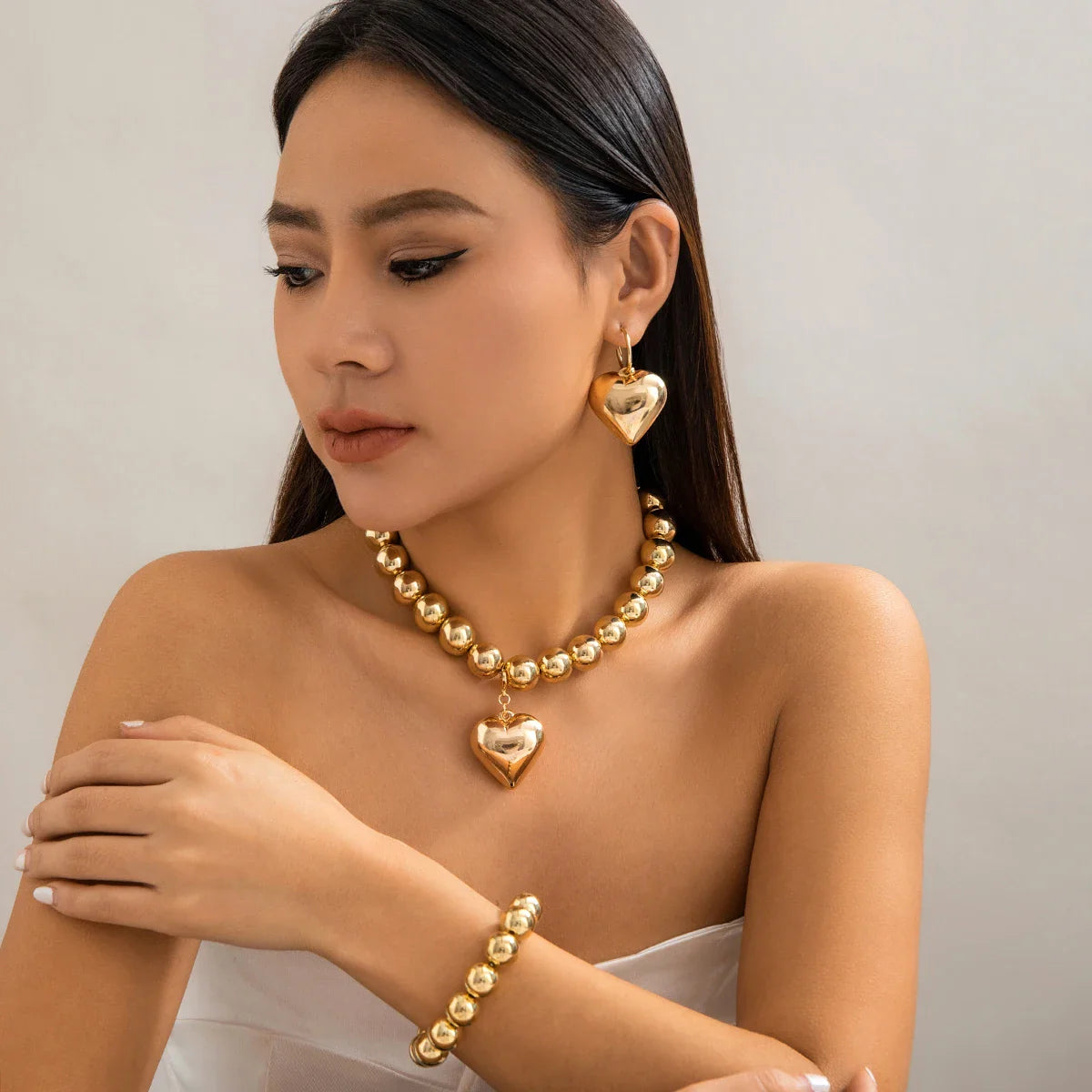 Conjunto Colar Brincos e Pulseira Coração Dourado